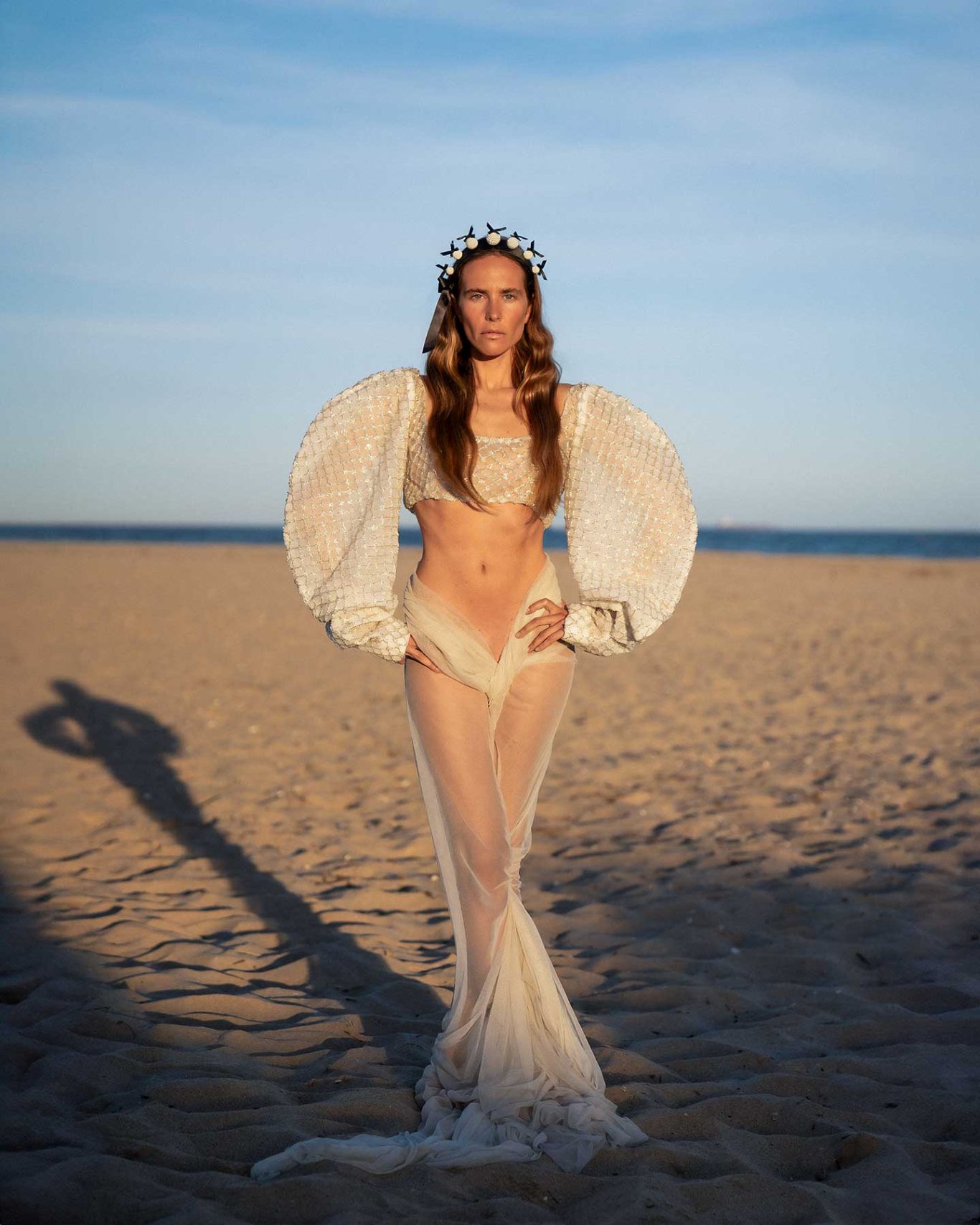 Brisa Singer and model Brisa Fenoy in an editorial portrait for Río Pícaro, photographed at sunset on Getares Beach, Algeciras. By Raúl Rosillo.