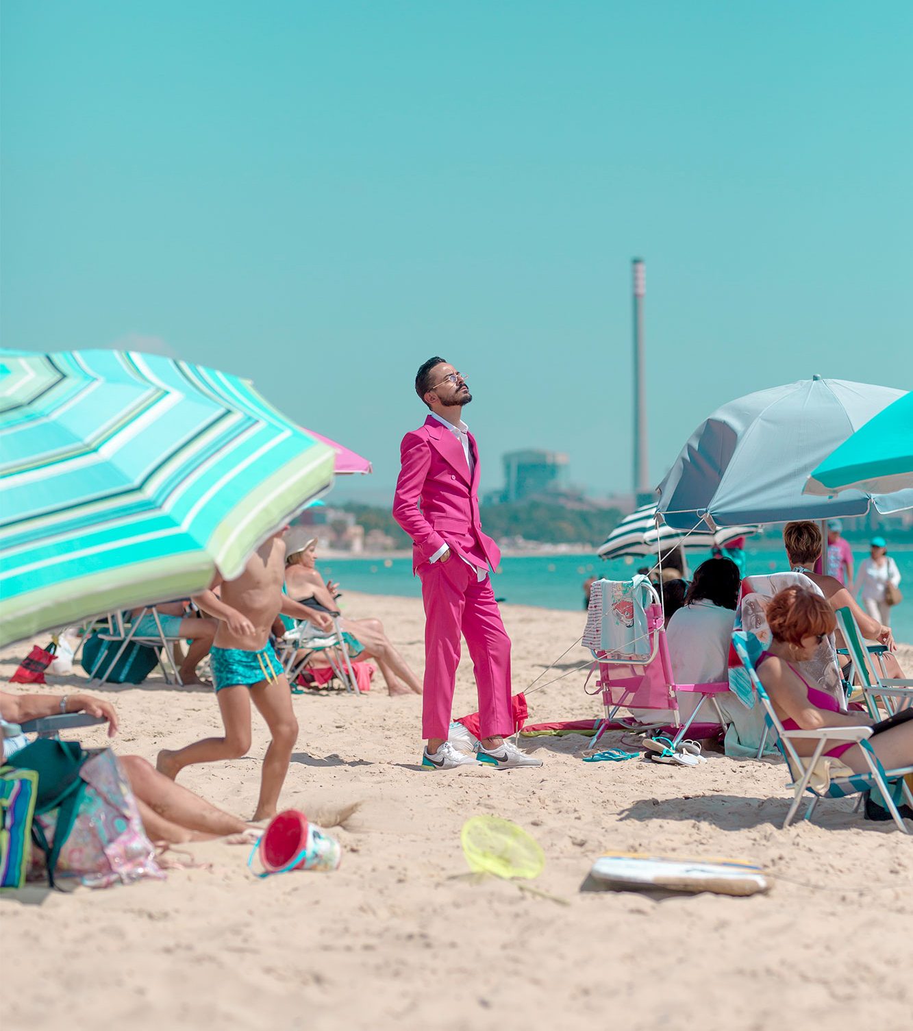 Raúl Rosillo Raúl Rosillo, creative director and visual artist, wearing a pink suit and posing on Rinconcillo beach in Algeciras during the summer