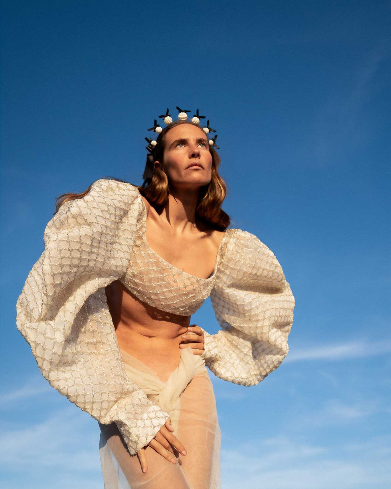 Brisa Singer and model Brisa Fenoy in an editorial portrait for Río Pícaro, photographed at sunset on Getares Beach, Algeciras. By Raúl Rosillo.