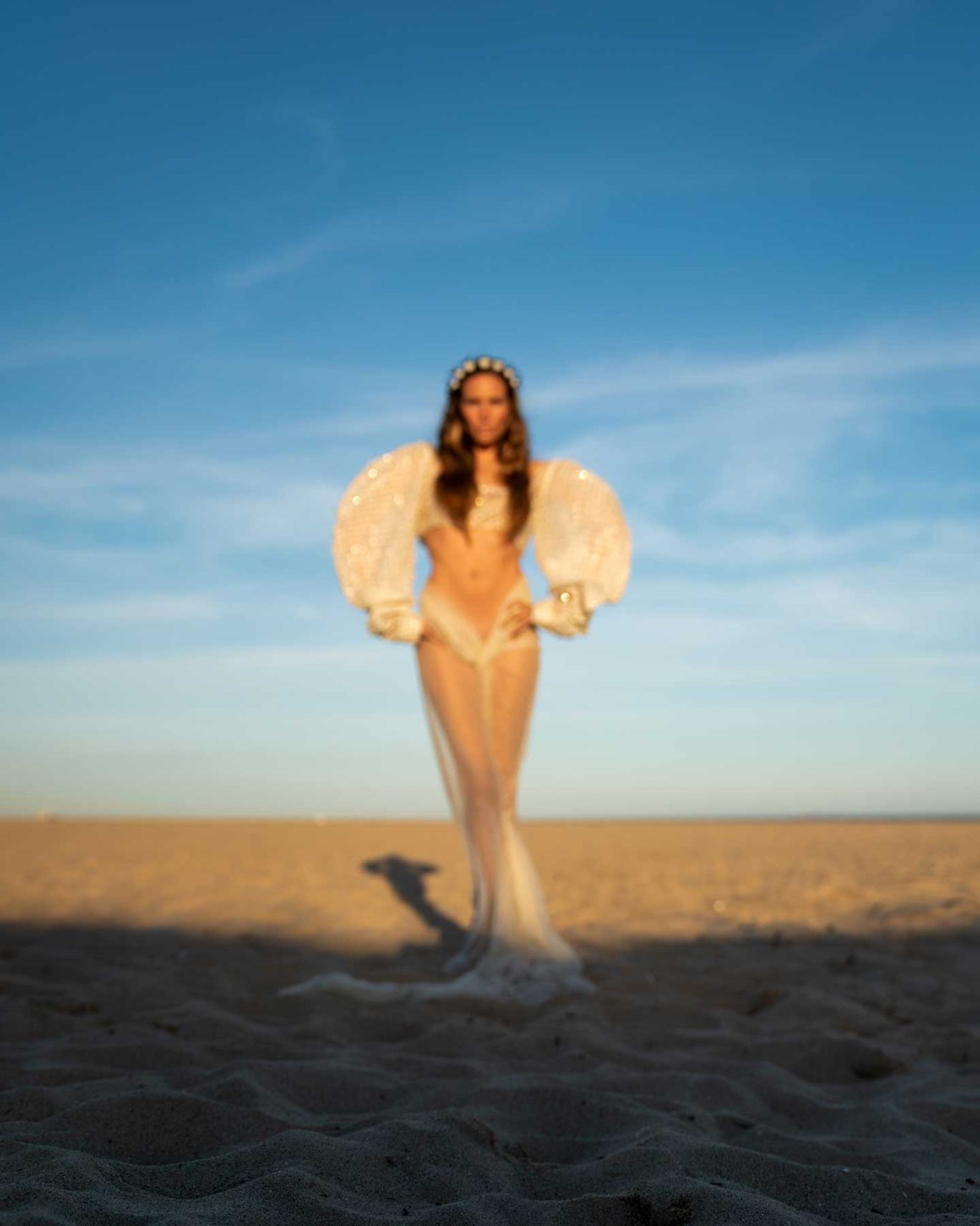 Brisa Singer and model Brisa Fenoy in an editorial portrait for Río Pícaro, photographed at sunset on Getares Beach, Algeciras. By Raúl Rosillo.